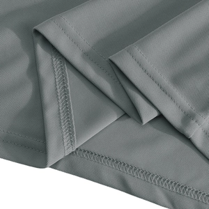 Macro shot of grey functional polo shirt showing breathable mesh fabric and double stitching