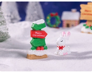 Detailed view of Merry Christmas signpost and miniature white deer for festive DIY decor