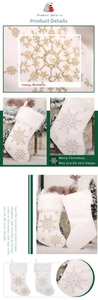 Detail showing white plush Christmas stocking with silver snowflake embroidery and pearls