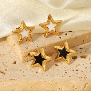 Star-shaped stainless steel stud earrings in black and white enamel with gold finish