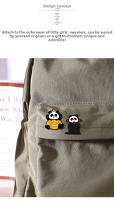 Detailed view of Halloween panda enamel pins attached to a khaki canvas backpack surface