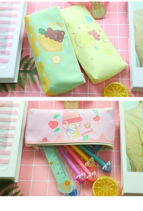 Close-up of creative PU leather pencil pouches with cute lemon bear and peach rabbit patterns