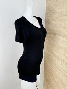 Detail of slim fit black V-neck short sleeve T-shirt on a white mannequin torso