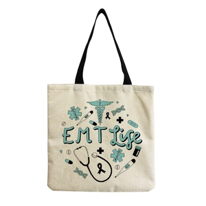 Close-up of nurse canvas tote bag featuring EMT Life art with medical stethoscope icons