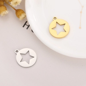 Detailed macro view of hollow star charms in gold and silver stainless steel finish