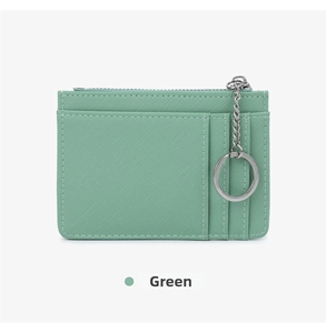 Detail of green crossgrain leather slim card holder with zipper and keychain ring