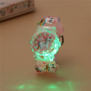 Pink cartoon unicorn kids watch with glowing green LED lights and soft silicone band