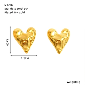 Detail of 18k gold plated stainless steel heart earring with liquid metal texture