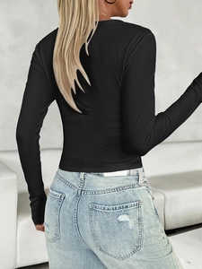 Back view of a black Y2K slim fit long sleeve ribbed knit top for women shown on a model