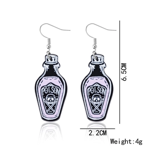 Detailed view of dark purple Poison bottle acrylic earrings with skull and wing accents