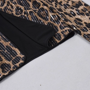 Close-up of leopard print sequins and stitching detail on women's blazer jacket