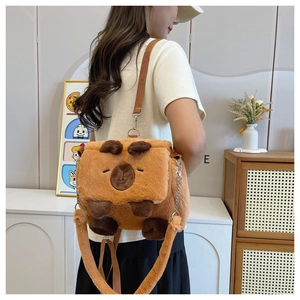Rear view of model wearing a plush Capybara crossbody bag with soft brown fur detail