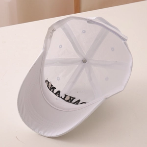 Detail of internal cotton stitching and Oakland embroidery on white baseball cap