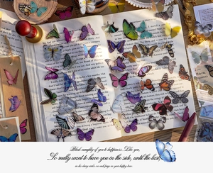 Detailed view of colorful transparent PET butterfly stickers on a vintage book