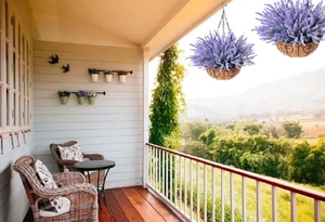 Hanging lavender planter with purple flowers in a coconut basket on a scenic balcony
