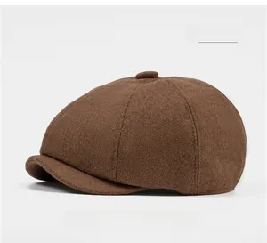Close-up of coffee brown wool newsboy cap showing textured fabric and stitching
