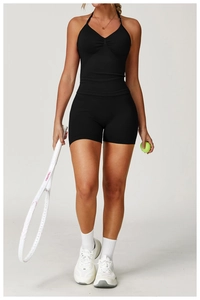 Women's black seamless high-waist yoga set with halter top and fitness shorts