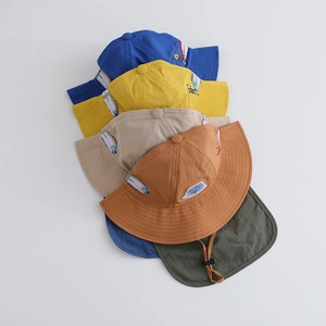 Close-up of quick-dry kids sun hats with neck flaps and cartoon vehicle embroidery