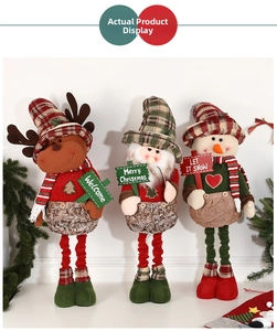 Three festive Christmas plush figures including Reindeer and Santa with holiday signs
