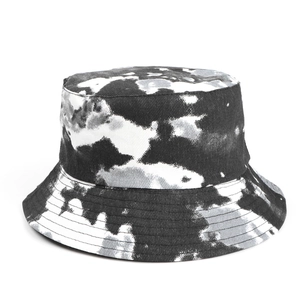 Close-up of black and white tie-dye bucket hat with reinforced stitching on the brim