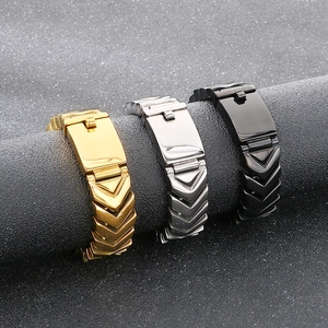 Detail of V-shaped link punk style stainless steel bracelets in gold, silver, and black