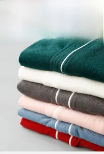 Detail of multi-color stacked towels with ribbed texture and striped patterns
