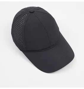 Detail of laser-cut mesh holes on black quick-dry baseball cap for enhanced airflow