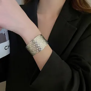 Irregular geometric textured wide silver cuff bracelet with a woven mesh metal finish