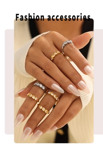 Detailed view of layered 18k gold and silver plated rings with round zircon inlays