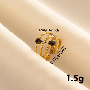 Detailed size view of a gold-plated layered ring featuring black enamel oval charms