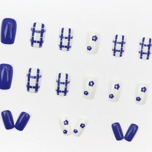 Short square press-on nails with Klein blue grid and floral patterns on white background