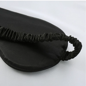 Silk sleep mask detail view, comfortable blackout eye cover for relaxing and sleeping in night.