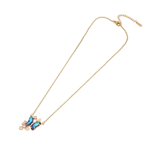 Elegant gold butterfly necklace with blue gemstones and clear crystals on fine chain