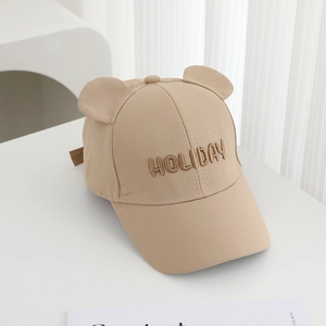 Close-up of khaki children's baseball cap with bear ears and holiday embroidery