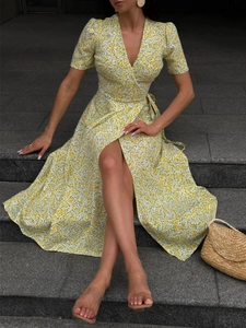 Floral V-neck short sleeve wrap dress with side tie and split hem in yellow print