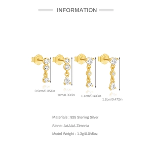 Detail of four golden S925 sterling silver geometric stud earrings with cubic zirconia stones