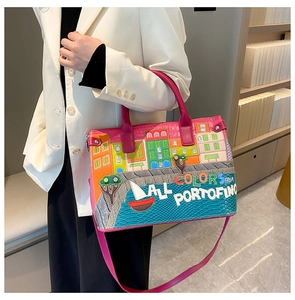 Detail of fuchsia tote bag featuring Portofino themed embroidery and artistic text design