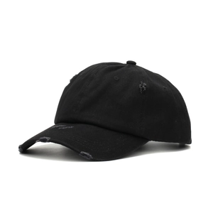 Close-up of distressed black cotton baseball cap with vintage worn-out details