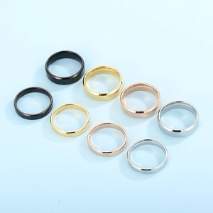 Polished stainless steel ring set in four colors and two widths on light blue background