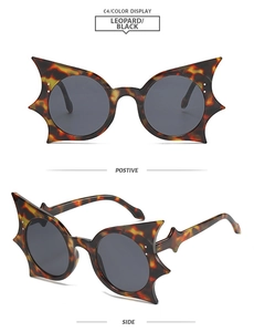 Macro detail of leopard print butterfly sunglasses with sharp points and metal accents