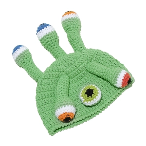 Green handmade crochet monster beanie with funny tentacles and colorful eyes for Halloween