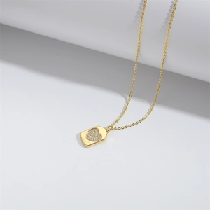 Elegant gold square medallion necklace with a sparkling heart pendant for women