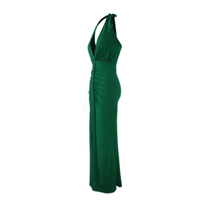Detail view of dark green halter dress featuring side ruching and slim fit silhouette