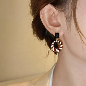 Vintage geometric drop earrings with black gemstone and spiral enamel circular pendant