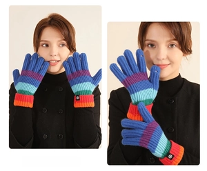 Detailed knit texture of colorful rainbow striped gloves with ribbed elastic wrist cuffs