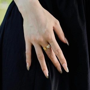 Close-up of golden S925 sterling silver adjustable open ring with H letter and zircon heart