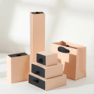 Modern light pink drawer jewelry box set with matching paper gift bags and ribbons