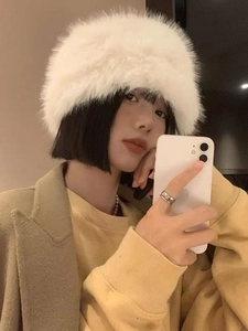 Detailed close-up of white faux fur plush bucket hat for women showing soft warm texture