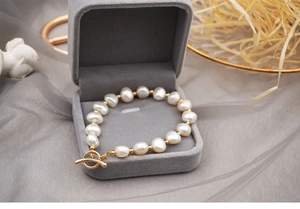 Detail of freshwater pearl bracelet with gold beads in a premium jewelry box