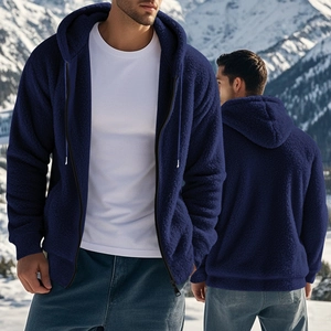 Detailed texture of thick navy blue polar fleece fabric on a winter hooded jacket